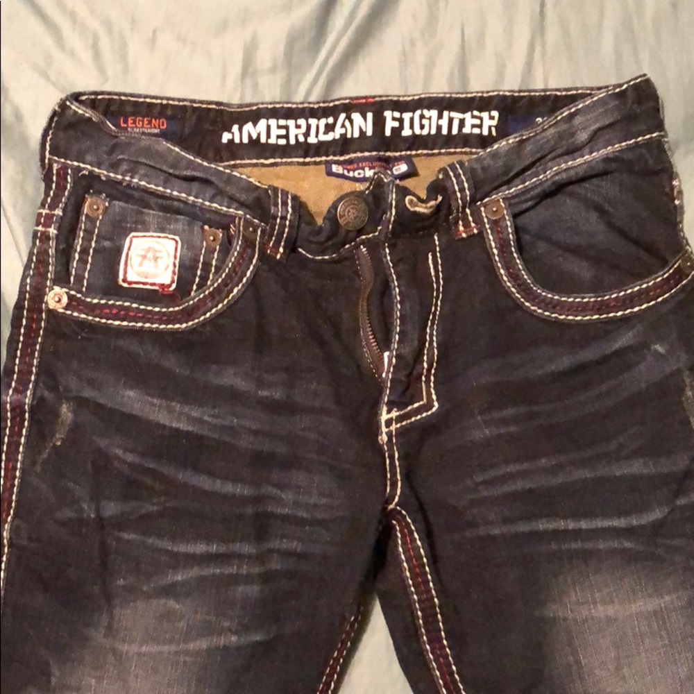 Buckle branded; American Fighter jeans